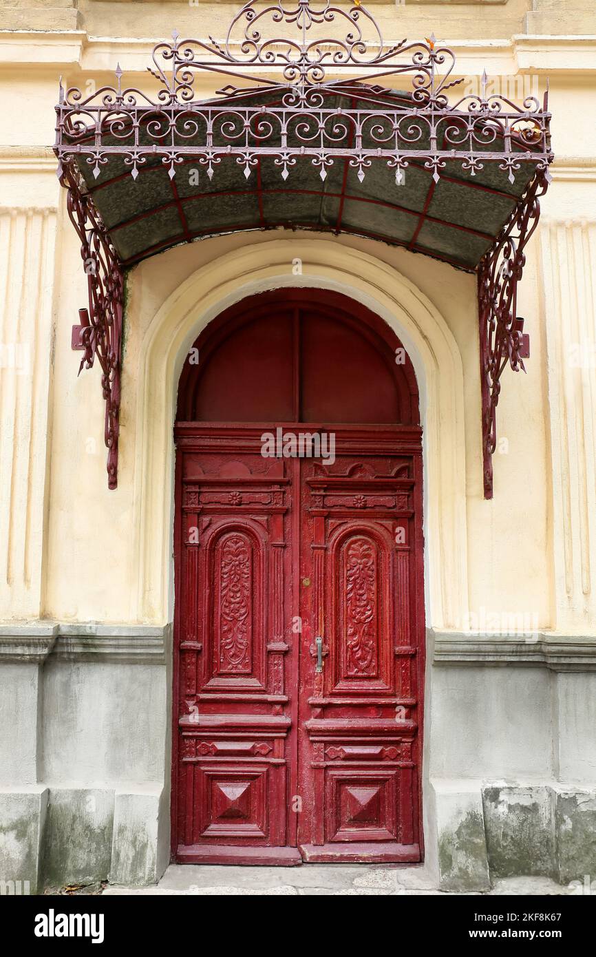 Old building with beautiful vintage door and visor Stock Photo - Alamy