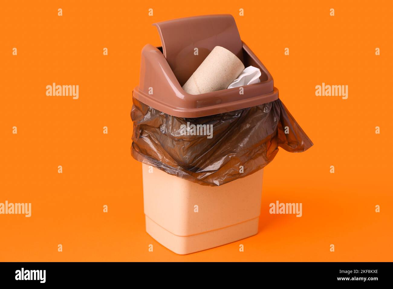 Rubbish bin with garbage on color background Stock Photo - Alamy