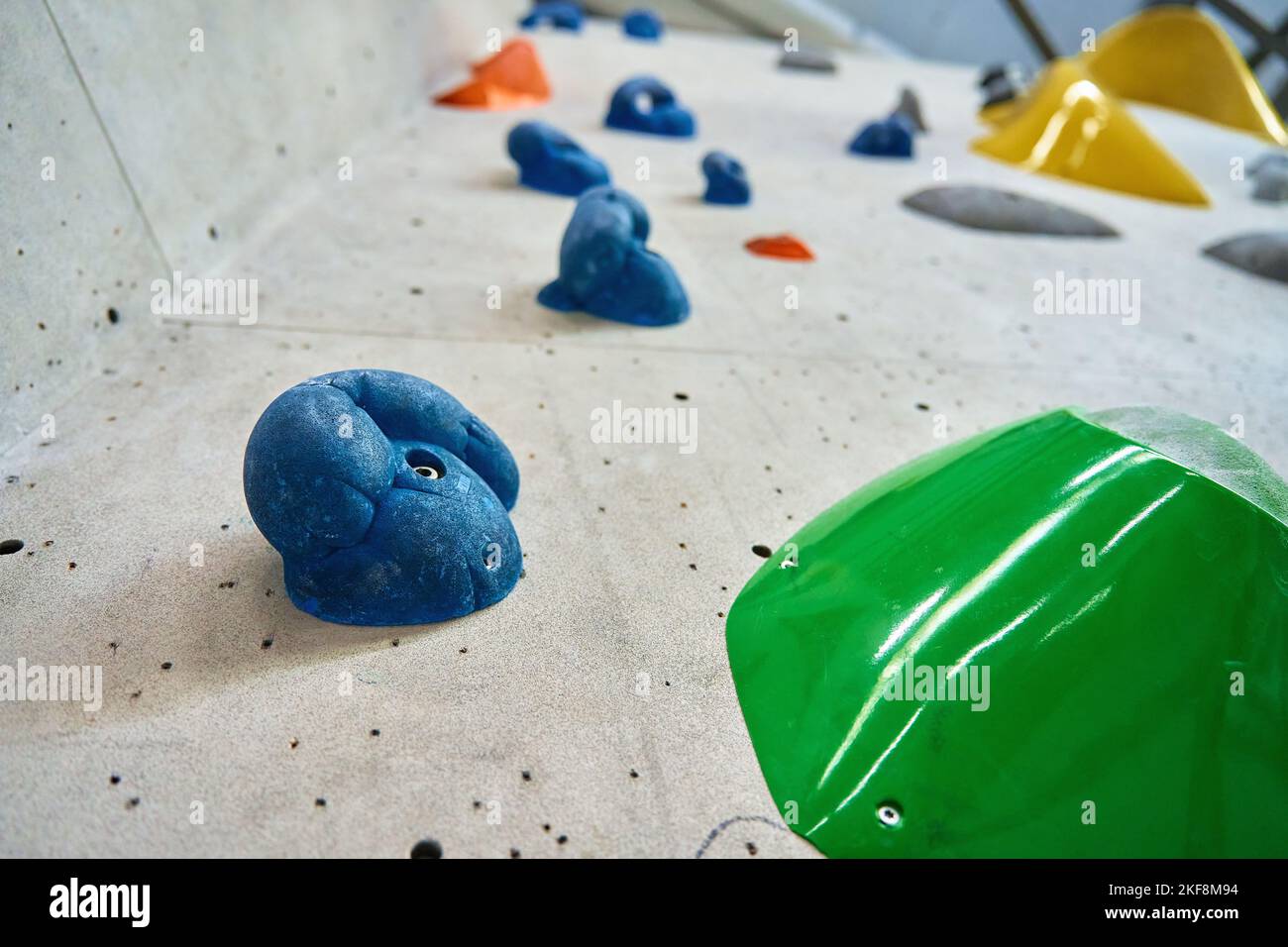 Wall for bouldering in gym with holds for climbing. Active extreme sport concept Stock Photo Alamy