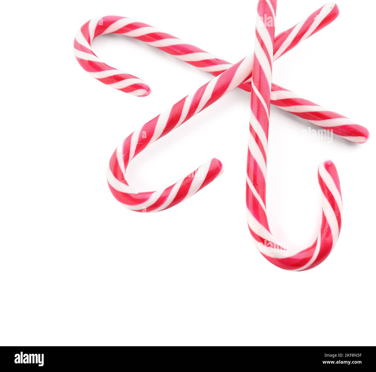 Tasty candy canes isolated on white background Stock Photo - Alamy