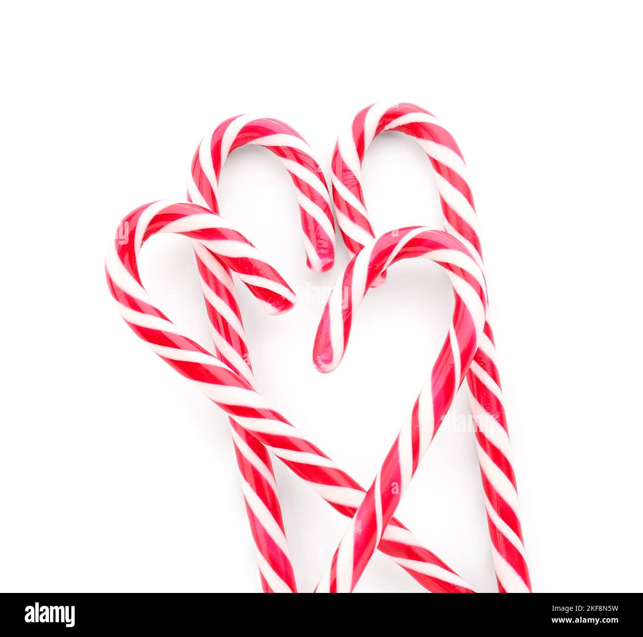 Delicious candy canes on white background Stock Photo - Alamy