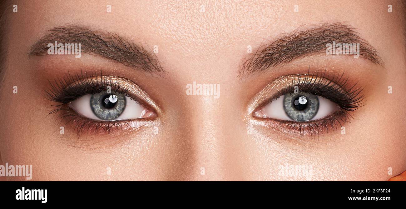 Beautiful female eyes with long eyelashes. Eyelash Extensions. Makeup, Cosmetics, Beauty. Close up, Macro Stock Photo