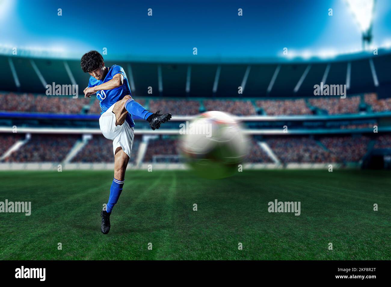 Soccer player kicking the ball Stock Photo Alamy