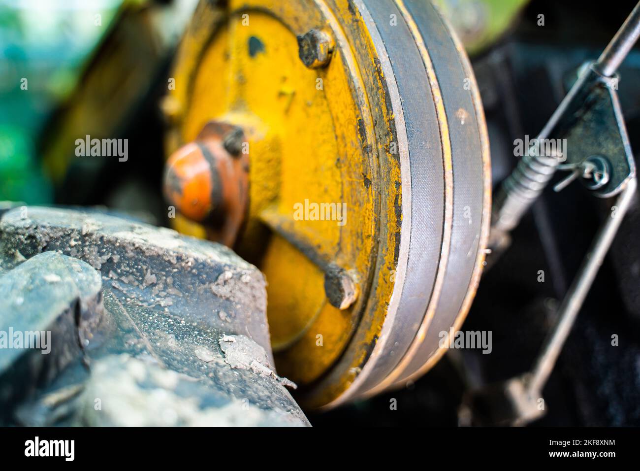 Walkbehind tractor pulley with two belts closeup. Tractor for