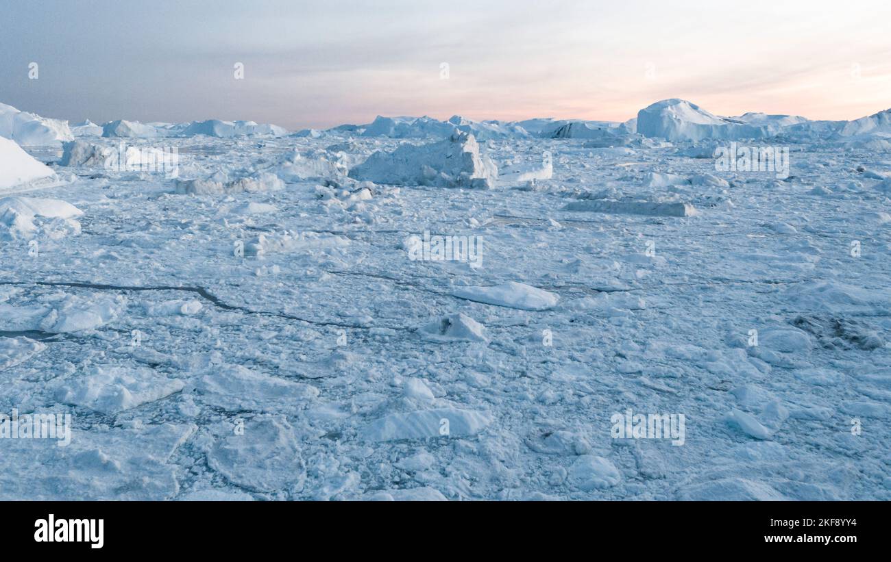 Climate Change and Global Warming. Icebergs from melting glacier in Ilulissat, Greenland. Arctic nature landscape affected by global warming Stock Photo