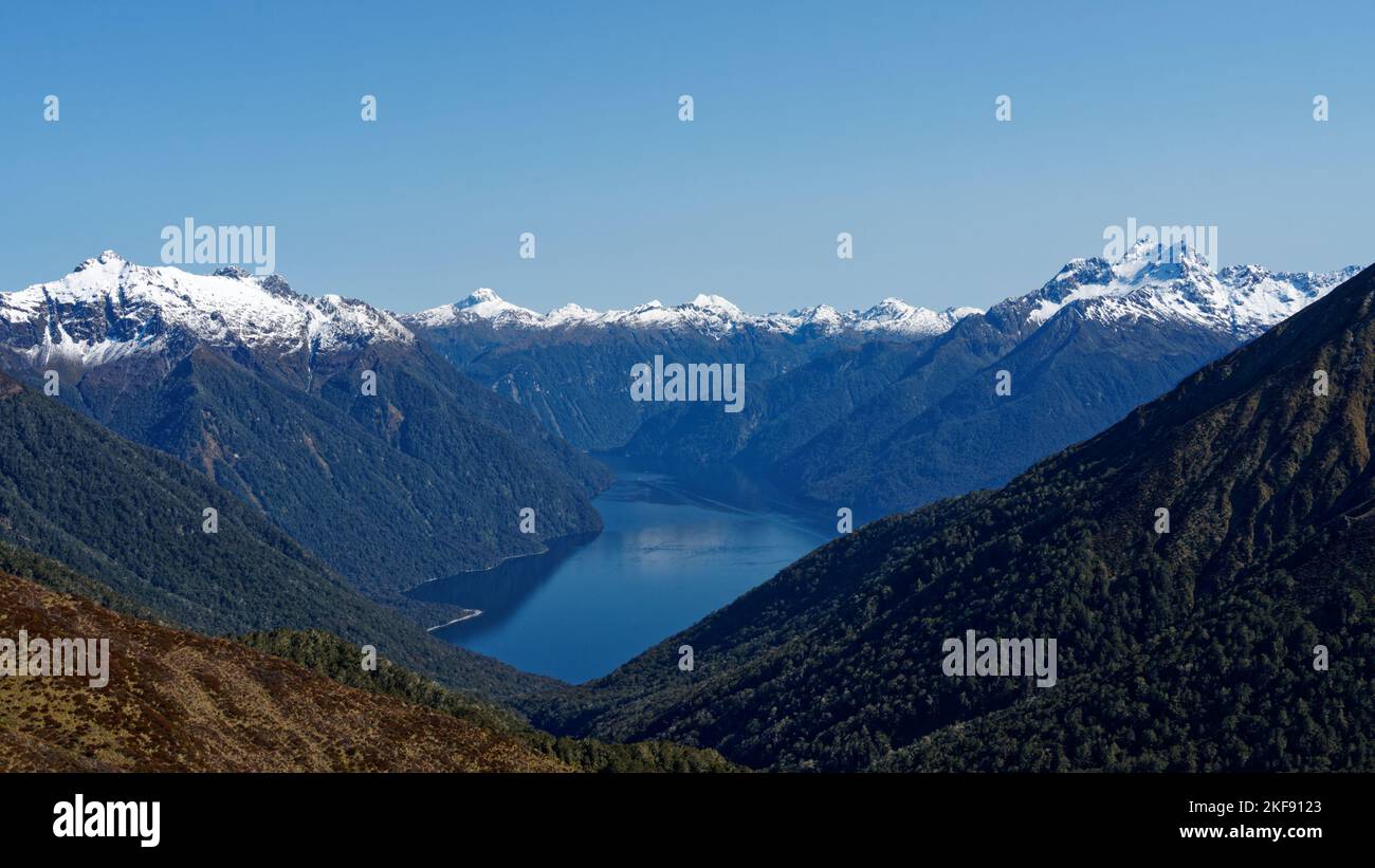 South Fiord and the snow capped Murchison Mountains viewed from the Kepler Track. Fiordland National Park, Southland, south island, New Zealand Stock Photo