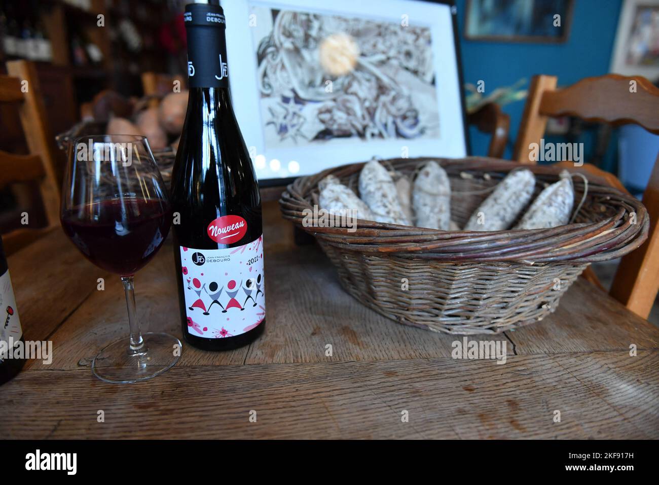 Wine fans celebrate the Beaujolais Nouveau's arrival in a bistrot on  November 17, 2022 in Paris, France. Beaujolais Nouveau is a red wine made  from Gamay grapes produced in the Beaujolais region