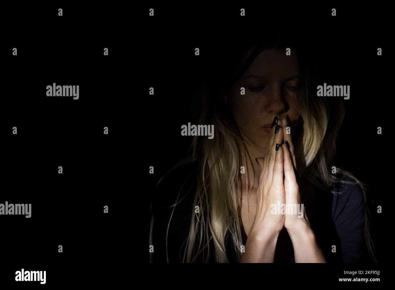 young girl praying to god in the dark, young girl in the dark, religion