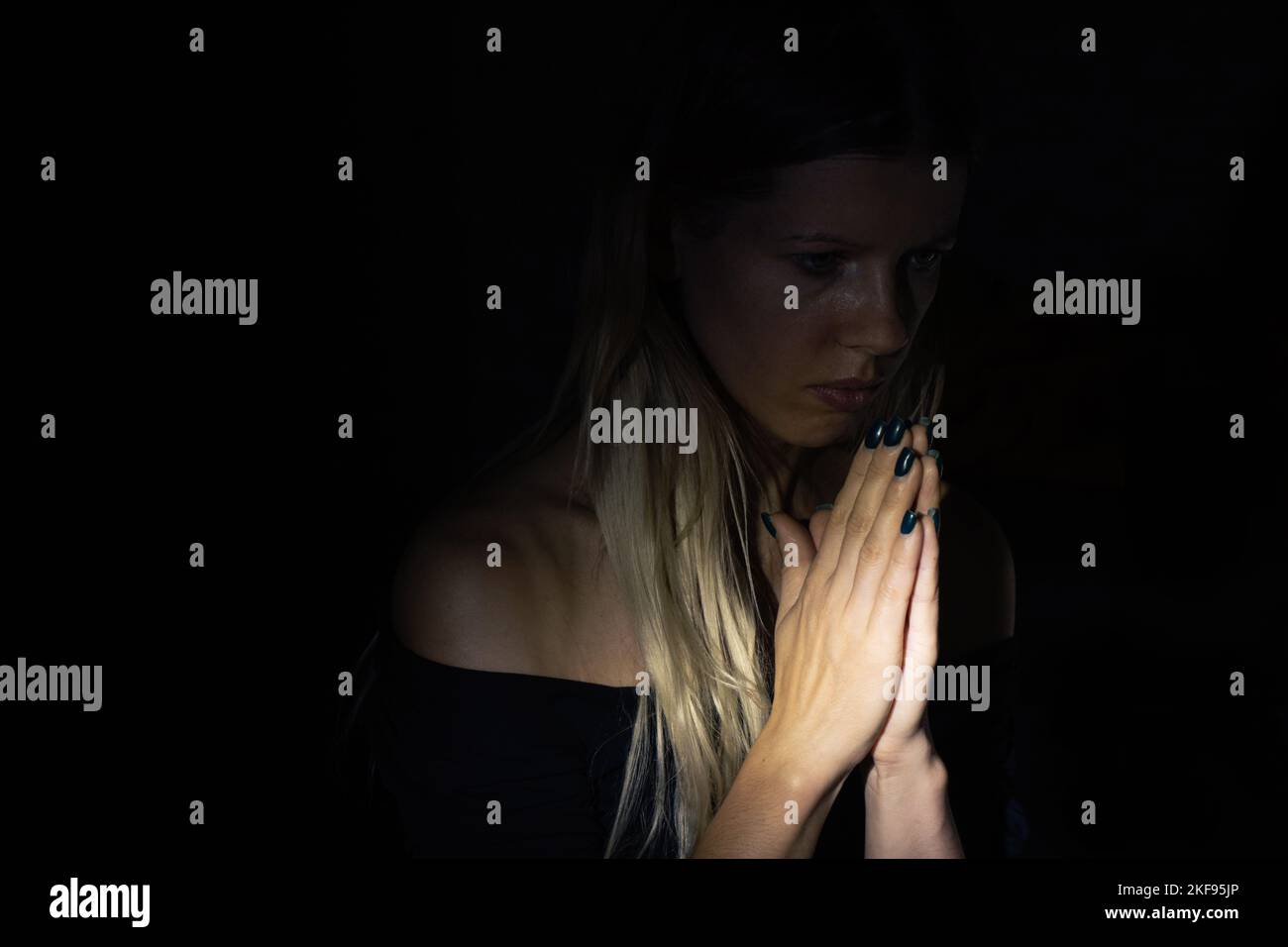 young girl praying to god in the dark, young girl in the dark, religion