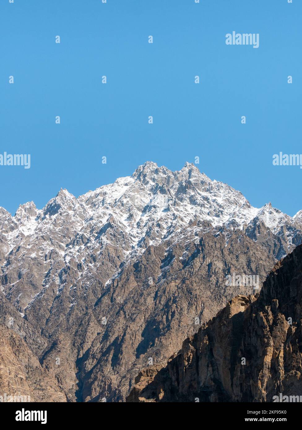 Moutainous landscape captured near Passu, in the Pakistani-Administered Kashmir region of Gilgit-Baltistan - Vertical Stock Photo
