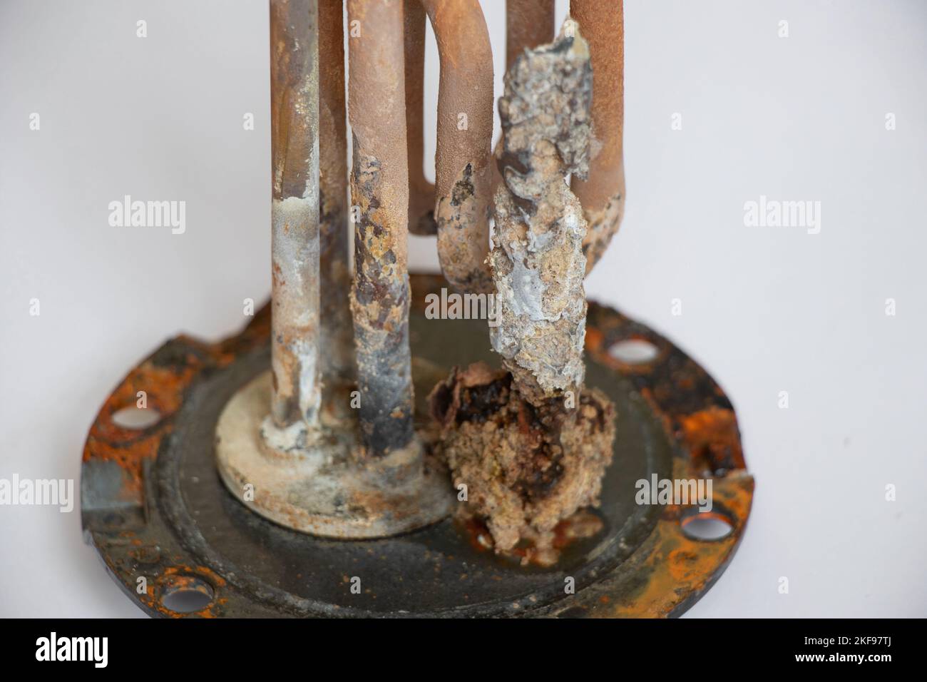 heating ten from a water heater after 8 years of operation broken on a white background