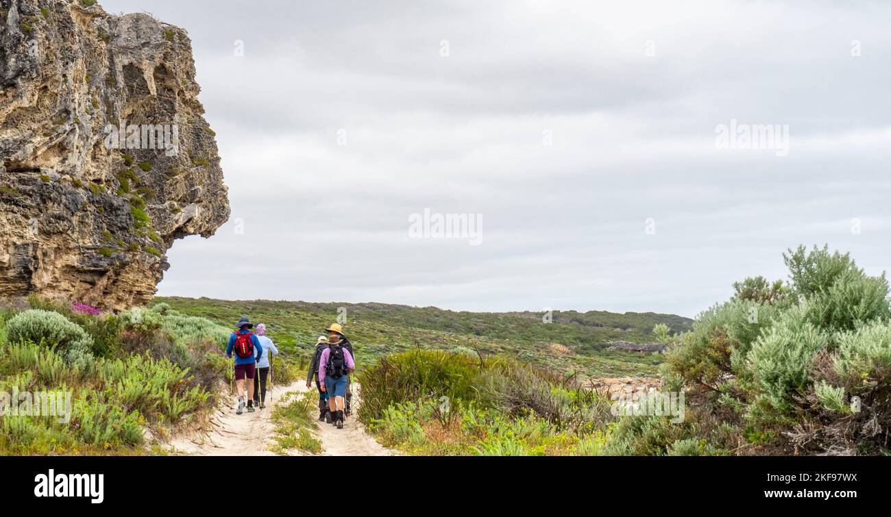 Walkers hiking the Cape to Cape Track walking pass Joey's Nose at Kilcarnup Beach Leeuwin-Naturaliste National Park Western Australia. Stock Photo
