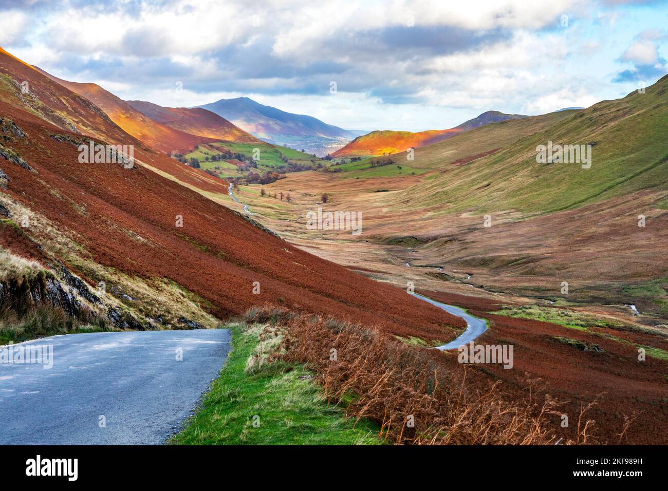 The roadway winding through Newlands Pass, The Lake District, Cumbria. Stock Photo
