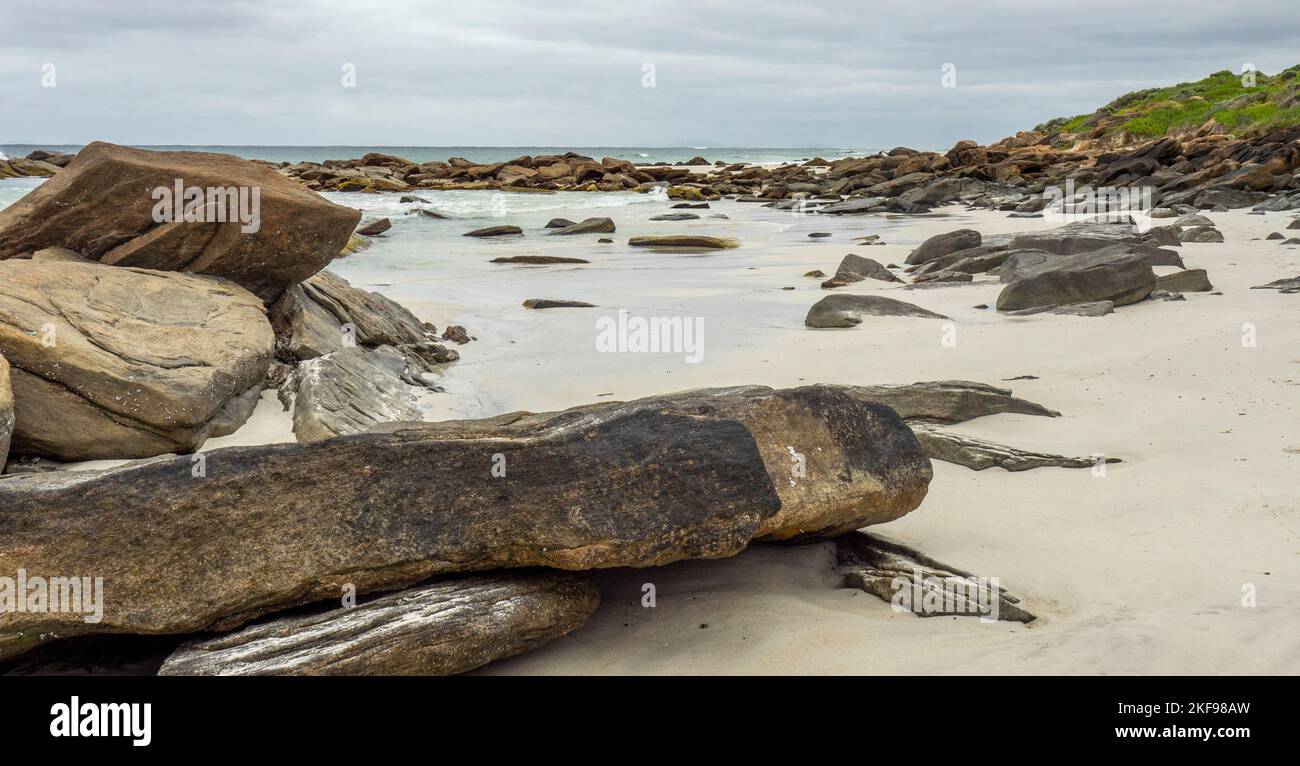 Granite rocks scattered on the beach at kilcarnup Beach Margaret River Leeuwin-Naturaliste National Park Western Australia. Stock Photo