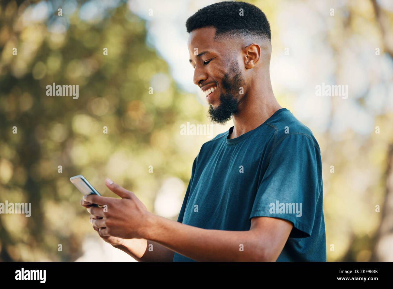 Black man with smartphone, communication outdoor with technology ...