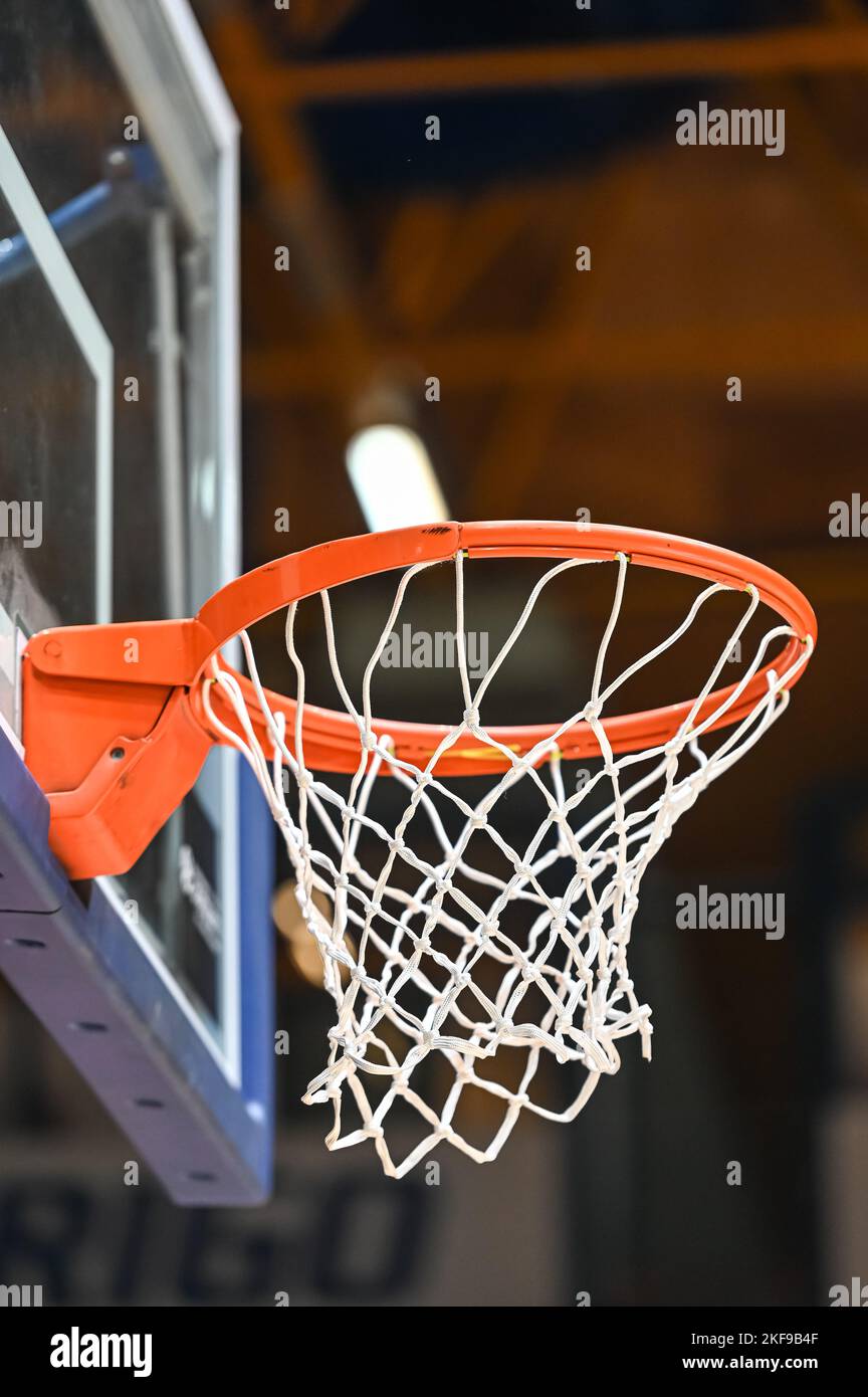 Indoor basketball basket net of white rope view from underneath against