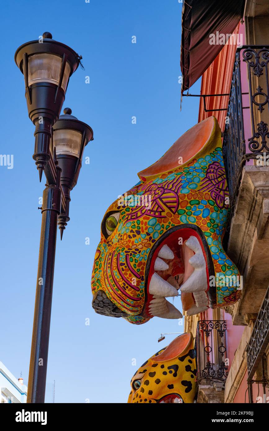 A large papier-mache jaguar alebrije decoration over the street during the Day of the Dead celebration in Oaxaca, Mexico. Stock Photo