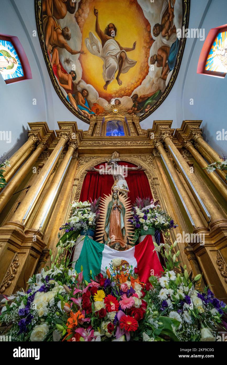 The altarpiece & ceiling painting in the Church of San Antonino Obisbo in San Antonino Castillo Velasco, Oaxaca, Mexico, built  the 1600's. Stock Photo