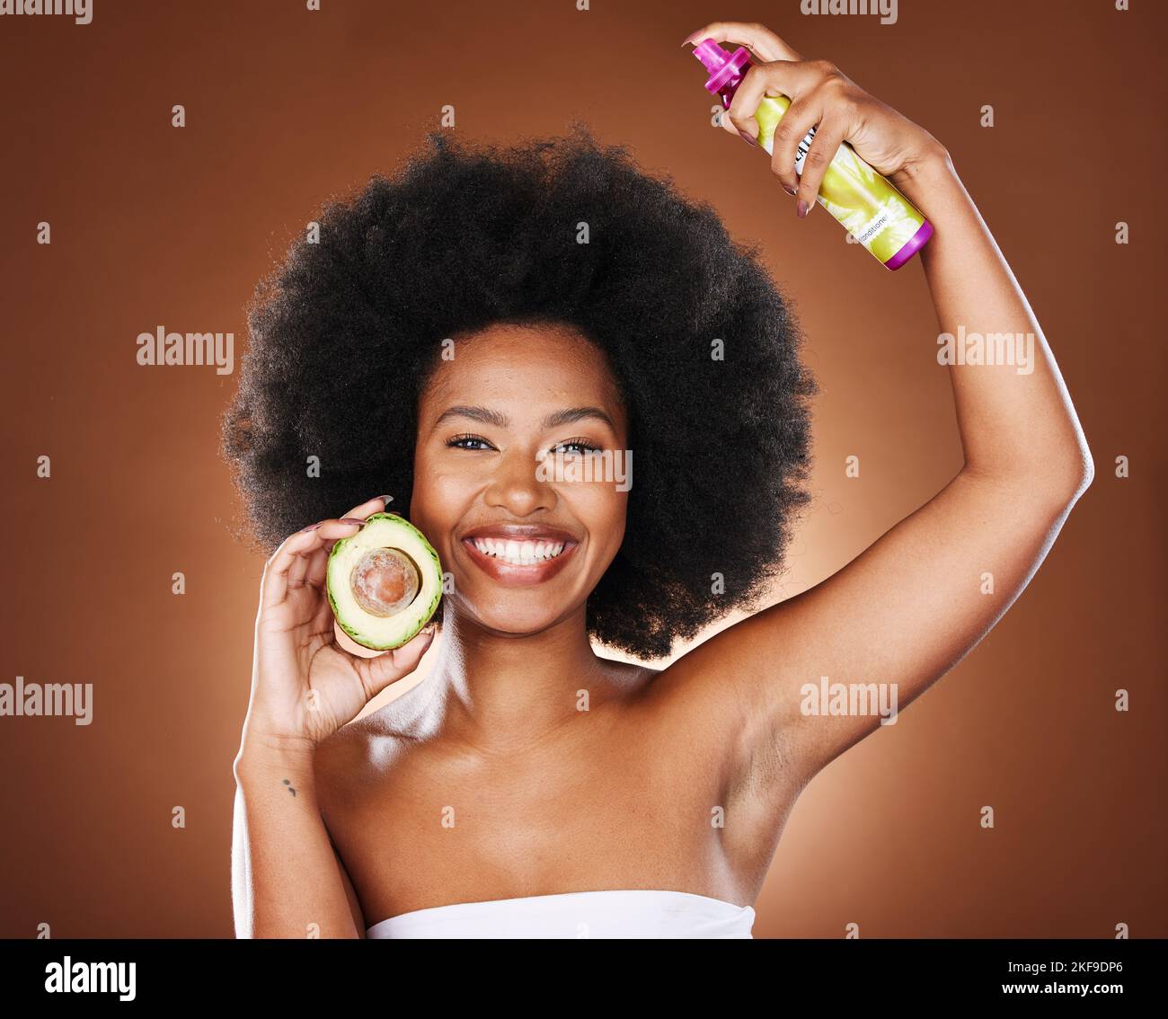 Black woman, hair care and spray with avocado, afro glow and care