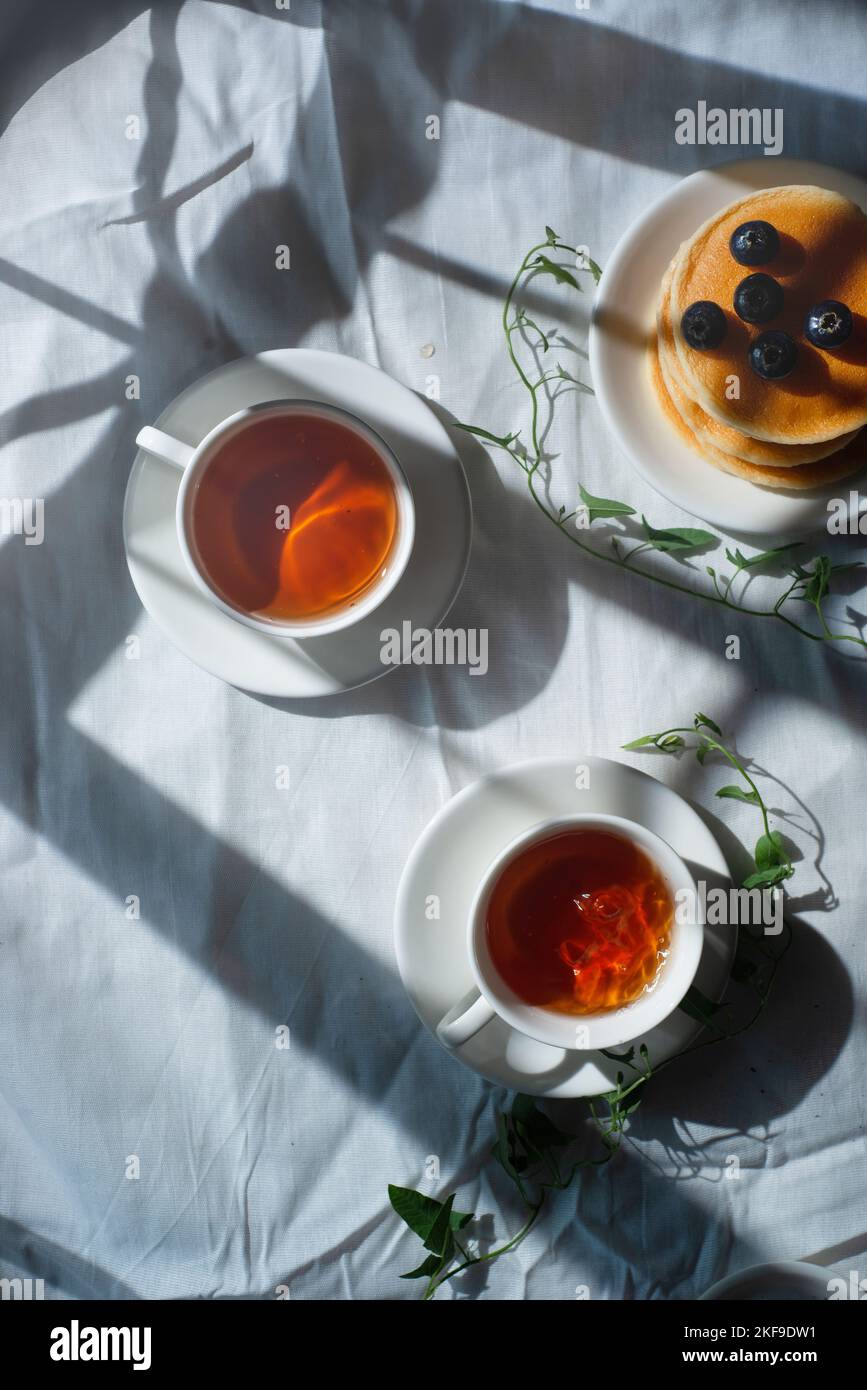 Cloth flatlay with teacups and vines, rustic aesthetic, cottagecore Stock Photo