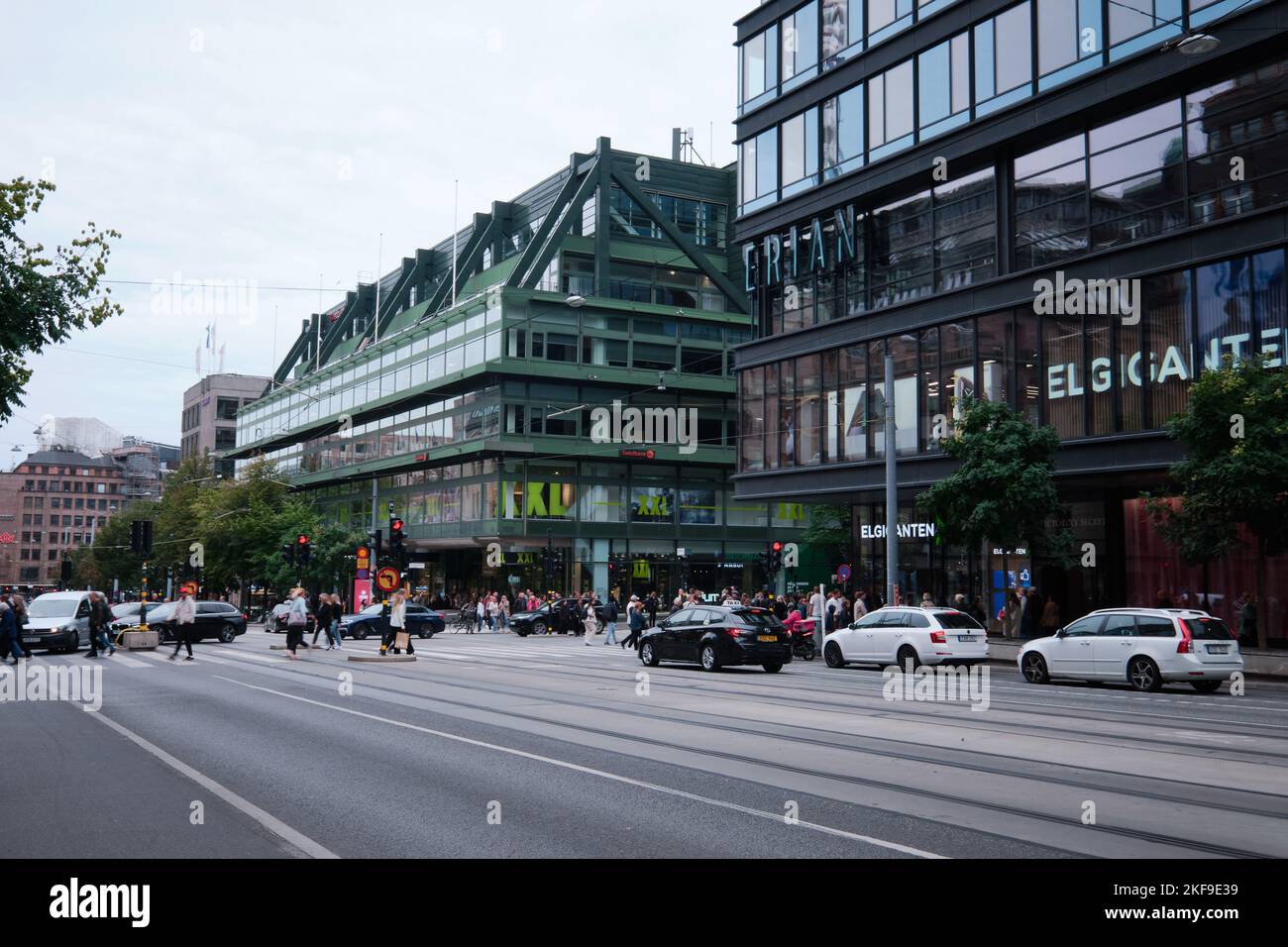 Stockholm, Sweden Sept 2022 Street view of department stores, cars in traffic and People on