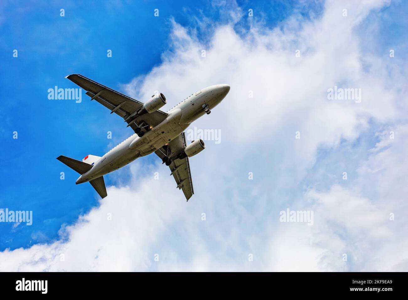 Airplane flying on the blue sky and cloud Stock Photo - Alamy