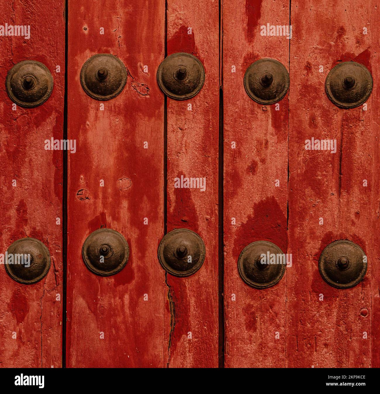 Decorative rivets on red door Stock Photo - Alamy