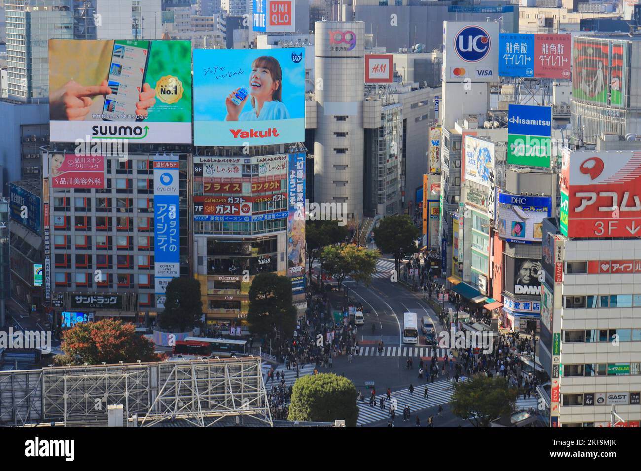 Modern buildings with shop signs during a sunny day, Tokyo, Japan Stock Photo