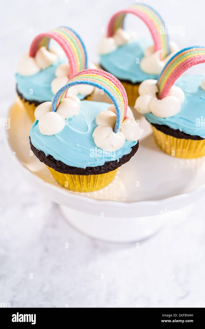 Step by step. Scooping batter with a cupcake scoop to make unicorn  chocolate cupcakes with buttercream frosting Stock Photo - Alamy