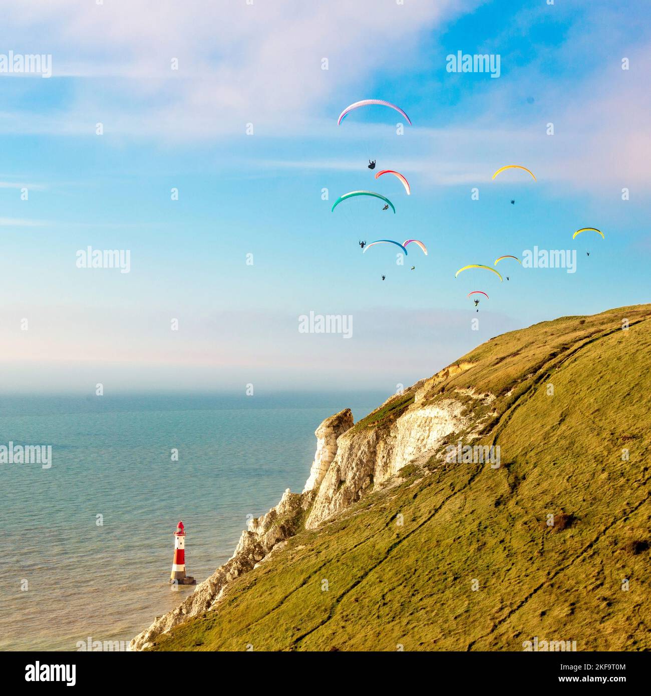 Paragliders over Beachy Head Lighthouse near Eastbourne, East Sussex Stock Photo