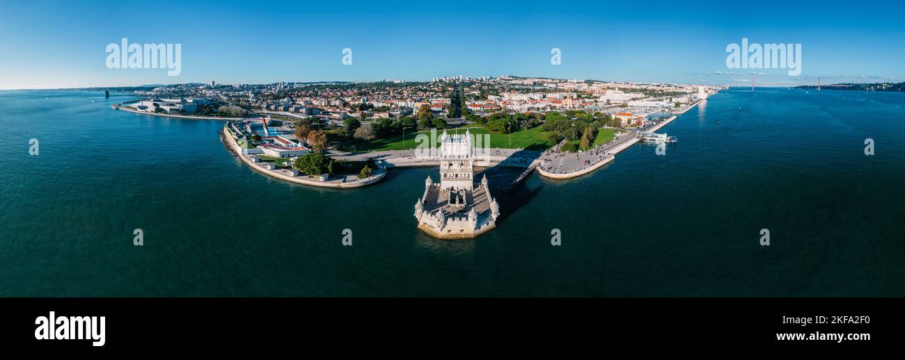 Aerial panorama of Belem Tower and Belem district at sunset. Tower of St Vincent on the bank of the Tagus River with discovery monument Stock Photo