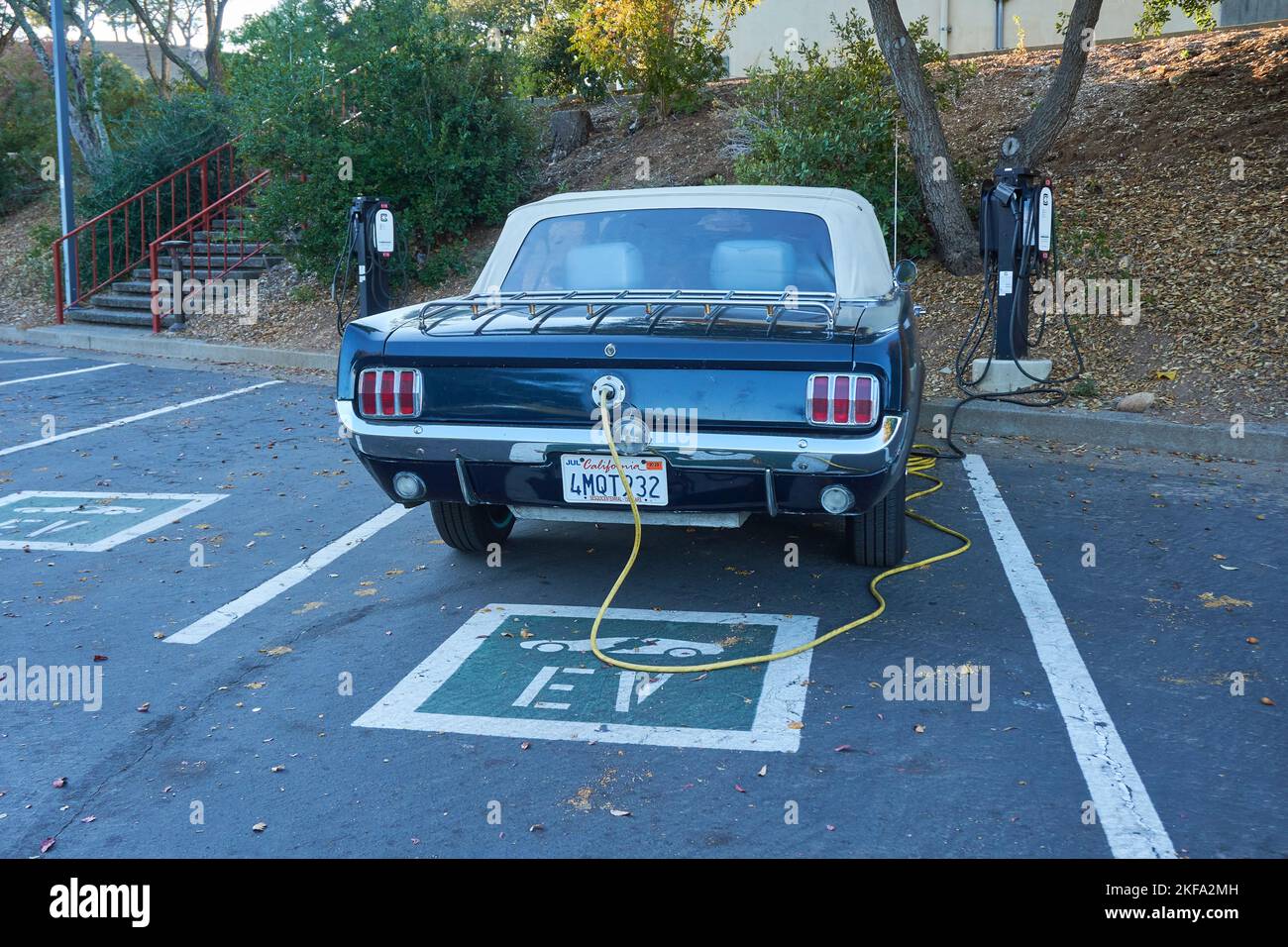 Mustang classic car converted to electric plugged into an EV charging
