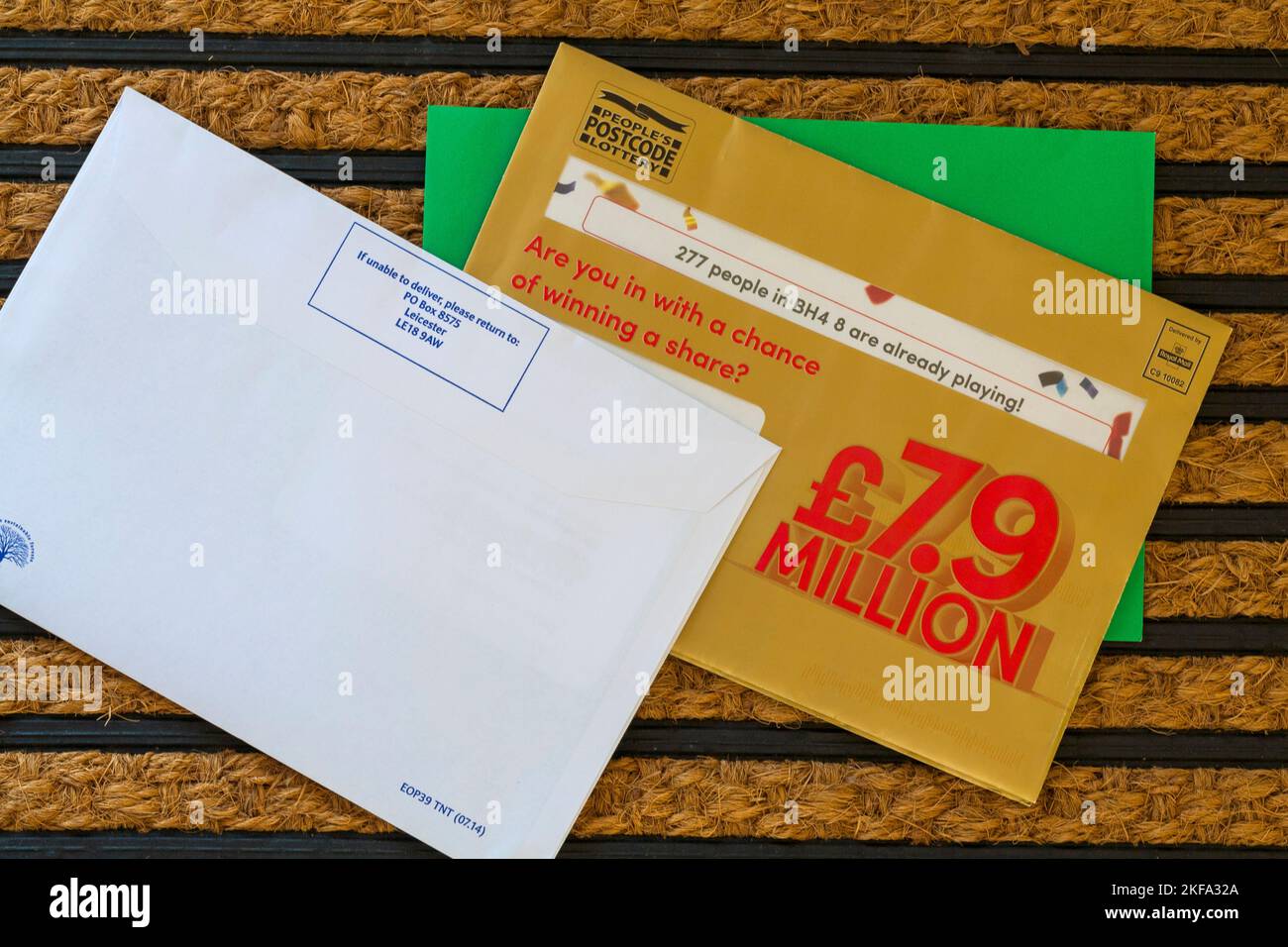 Post mail on doormat - Peoples Postcode Lottery 277 people in BH4 8 are already playing. Are you in with a chance of winning a share?  £7.9 Million Stock Photo