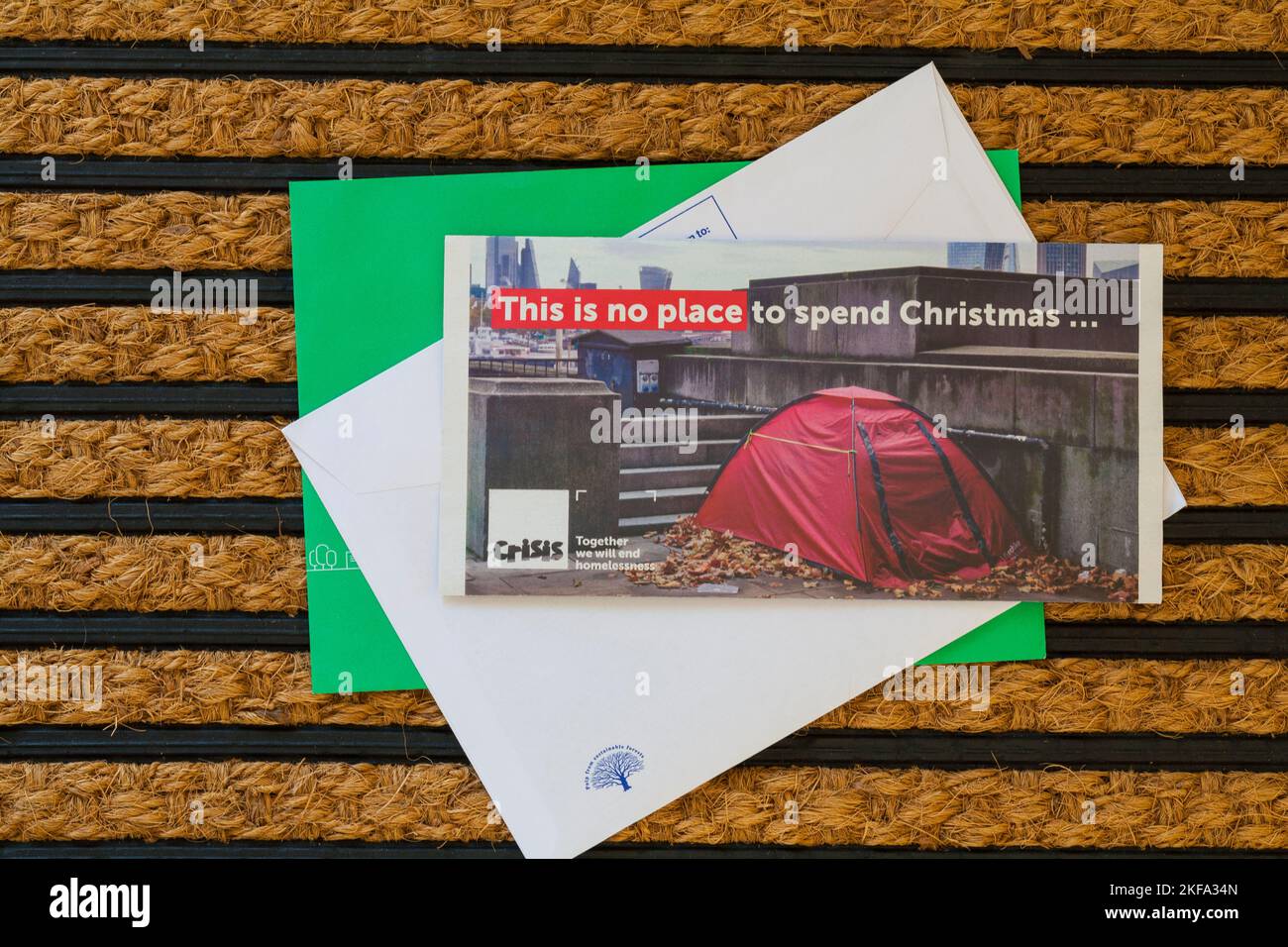 Post mail on doormat - charity appeal from Crisis, This is no place to spend Christmas Crisis together we will end homelessness Stock Photo