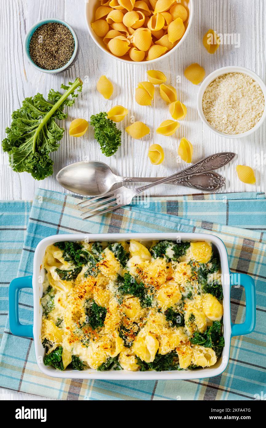 cheesy baked shell pasta with green leafy kale topped with crispy ...