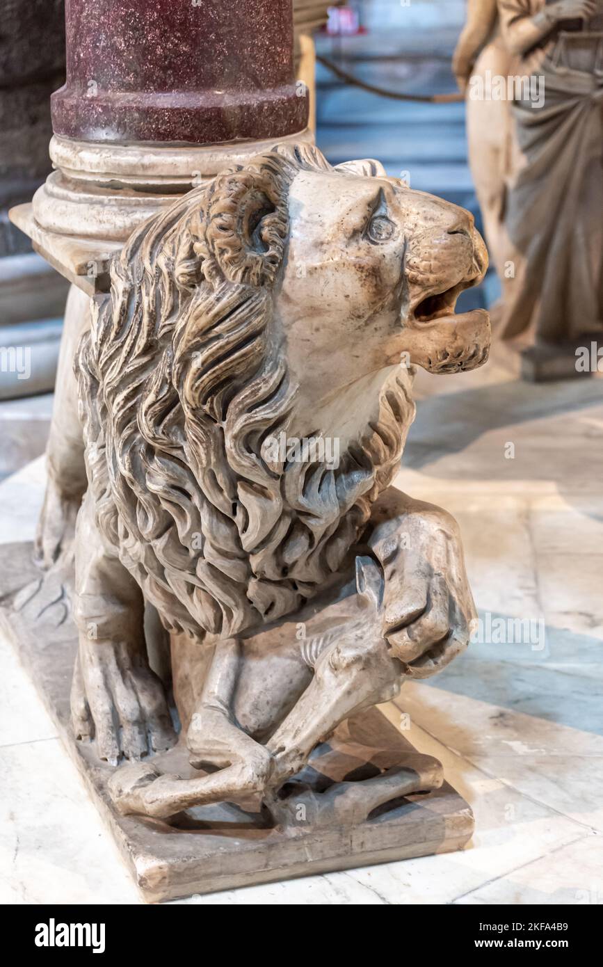 Close-up on marble statue representing a lion preying a foal Stock Photo
