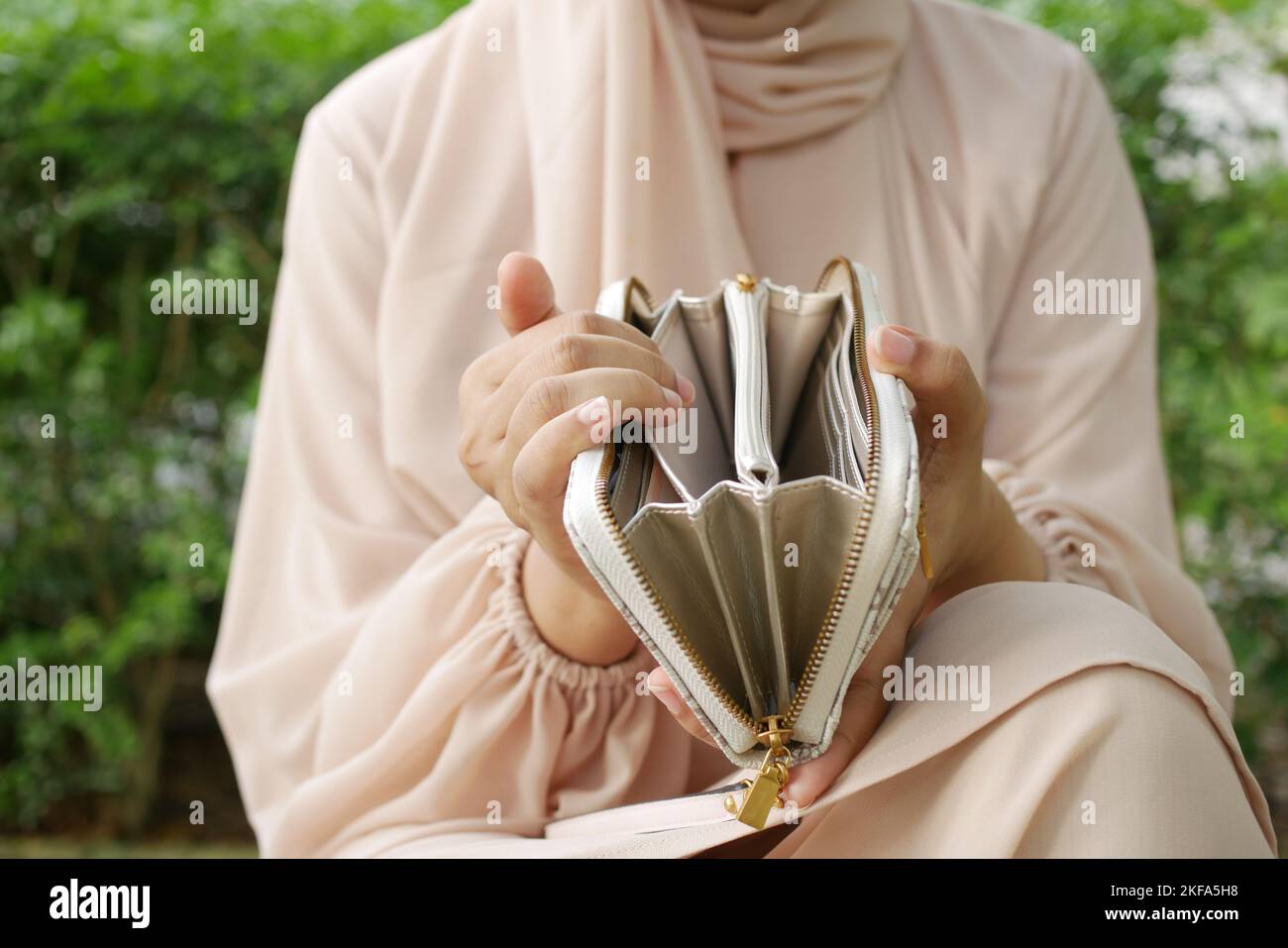 women hand open an empty wallet Stock Photo