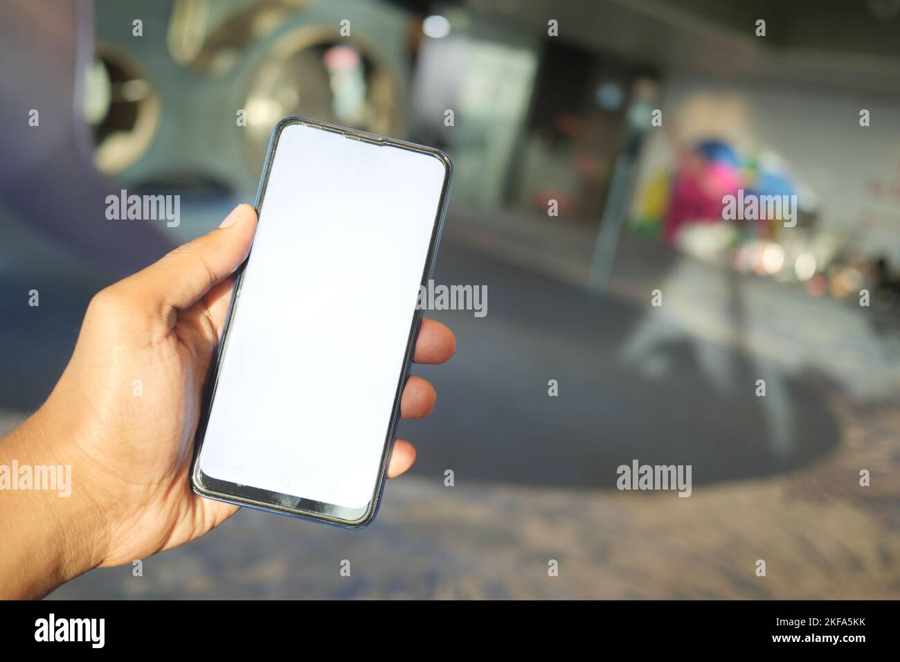 young man hand using smart phone with green screen at cafe Stock Photo ...