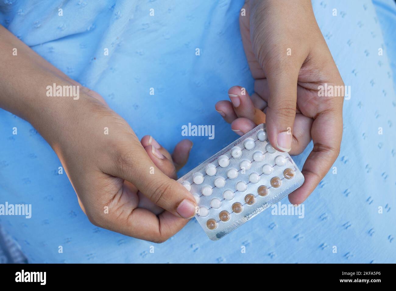 women hand holding birth control pills close up  Stock Photo