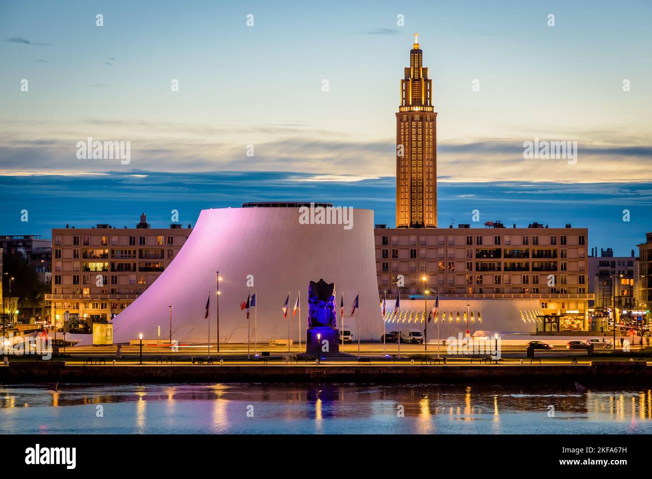 The Volcan cultural center, the Oscar Niemeyer public library and the bell tower of St. Joseph's Church in Le Havre, France, at nightfall. Stock Photo