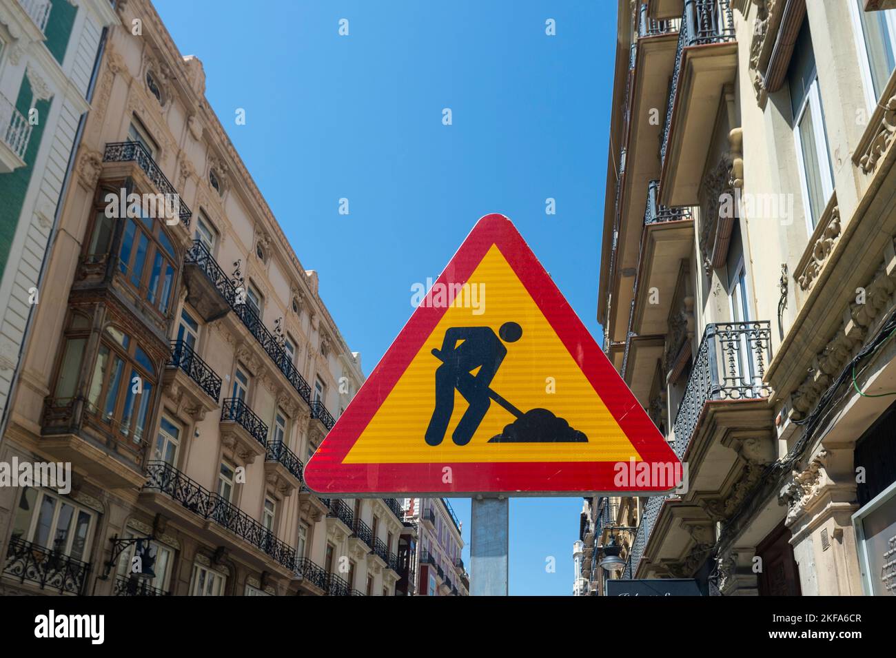 Road Work Ahead traffic warning sign in Valencia city, Spain. Stock Photo