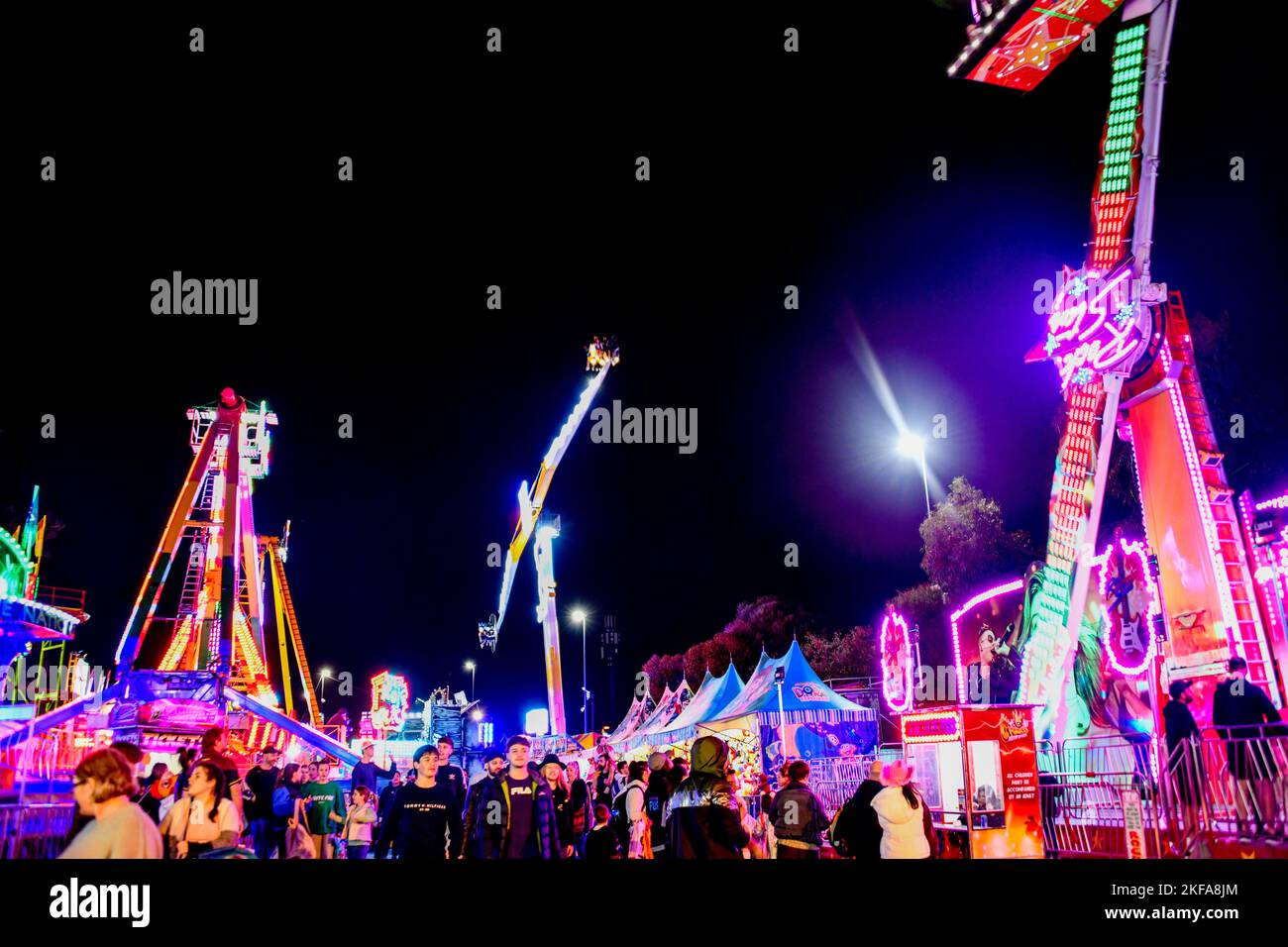 People Enjoying Fast Spinning Amusement Rides at The Royal Melbourne ...