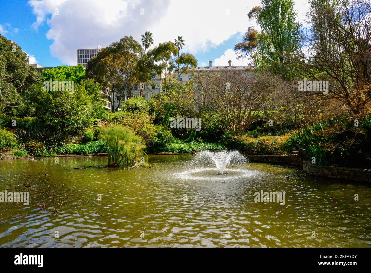 Water Fountains and Lake Fitzroy Gardens on a Bright Sunny Day in Melbourne, Victoria VIC, Australia Stock Photo