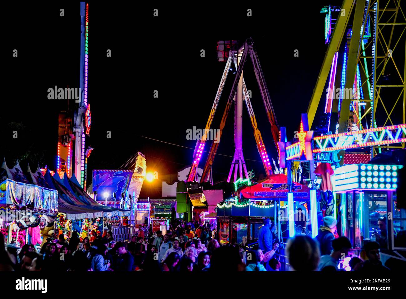 People Enjoying Fast Spinning Amusement Rides at The Royal Melbourne Show, Melbourne, Victoria VIC, Australia Stock Photo