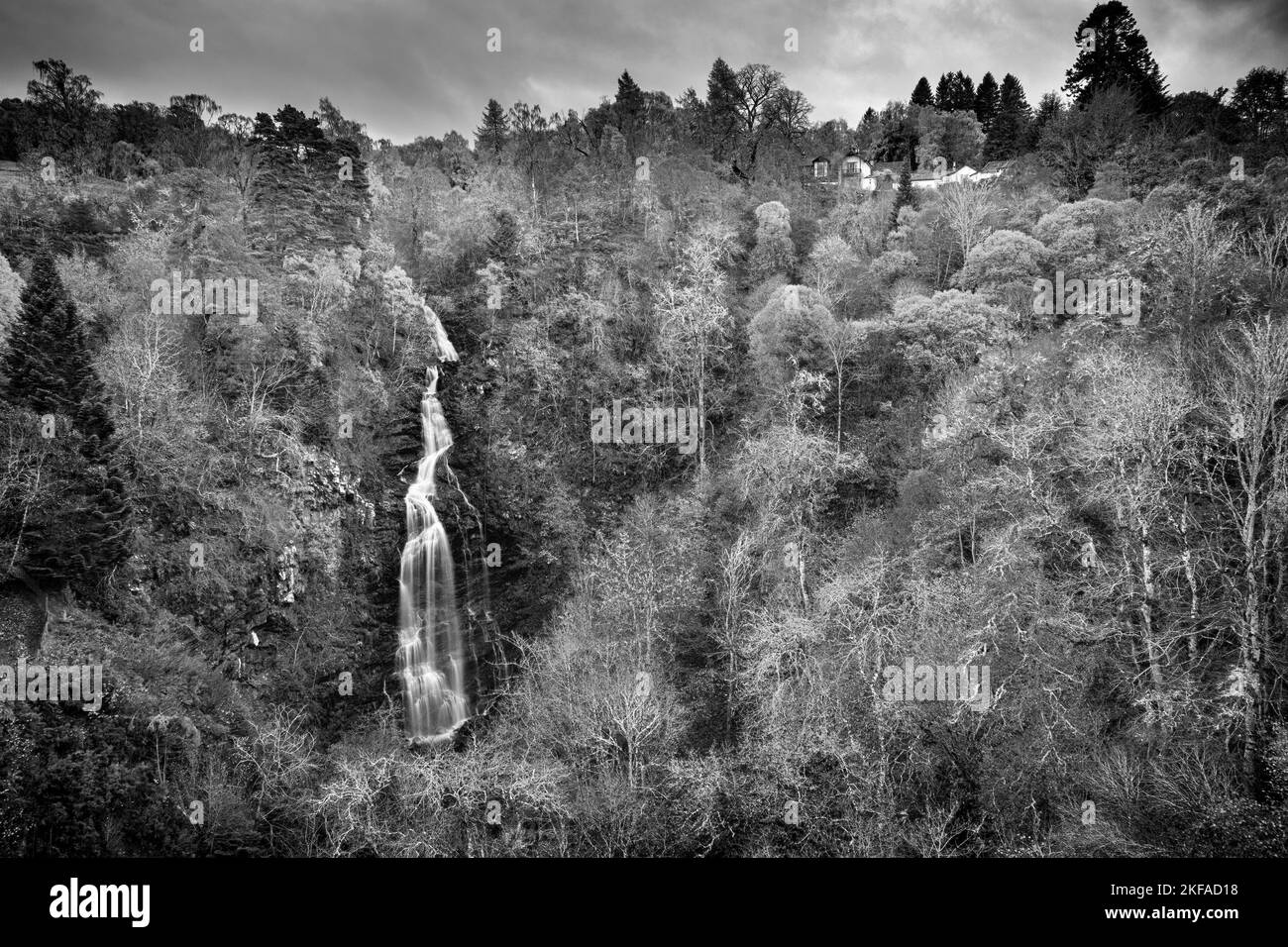 The falls of Divach above Drumnadrochit with Divach Lodge nestled in the trees above.  It is easy to see how this place could have inspired J.M Barrie Stock Photo