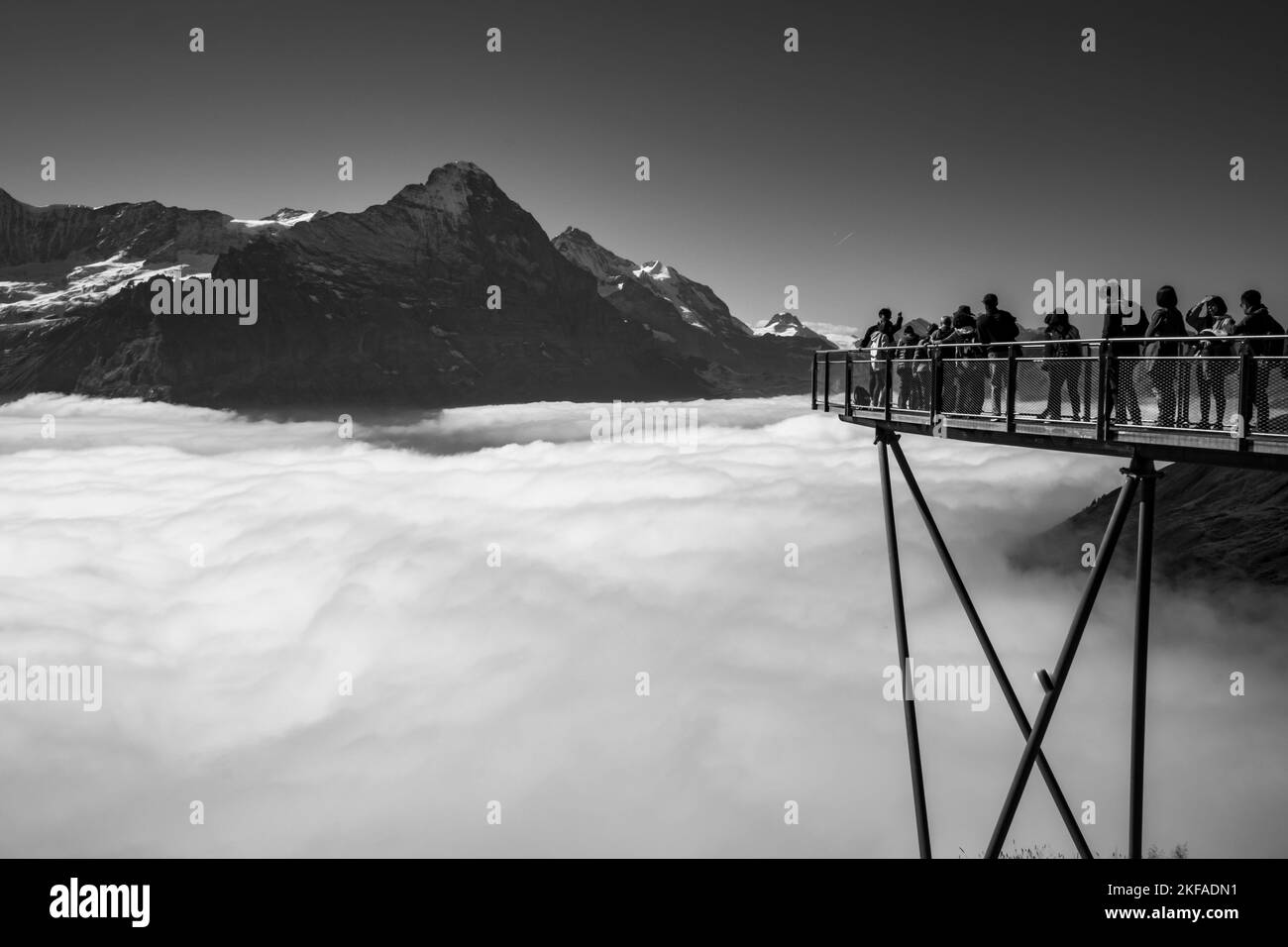 people on view point platform against Alpine mountain range Stock Photo