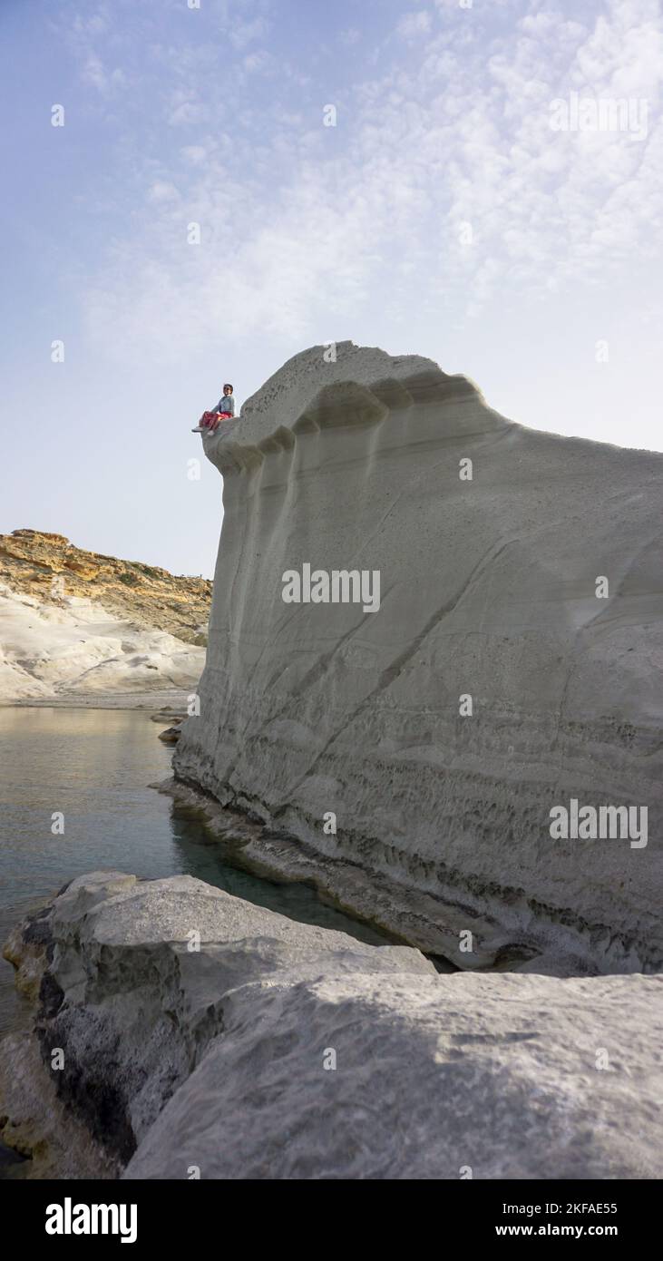 Girl sitting on edge cliff hi-res stock photography and images - Alamy