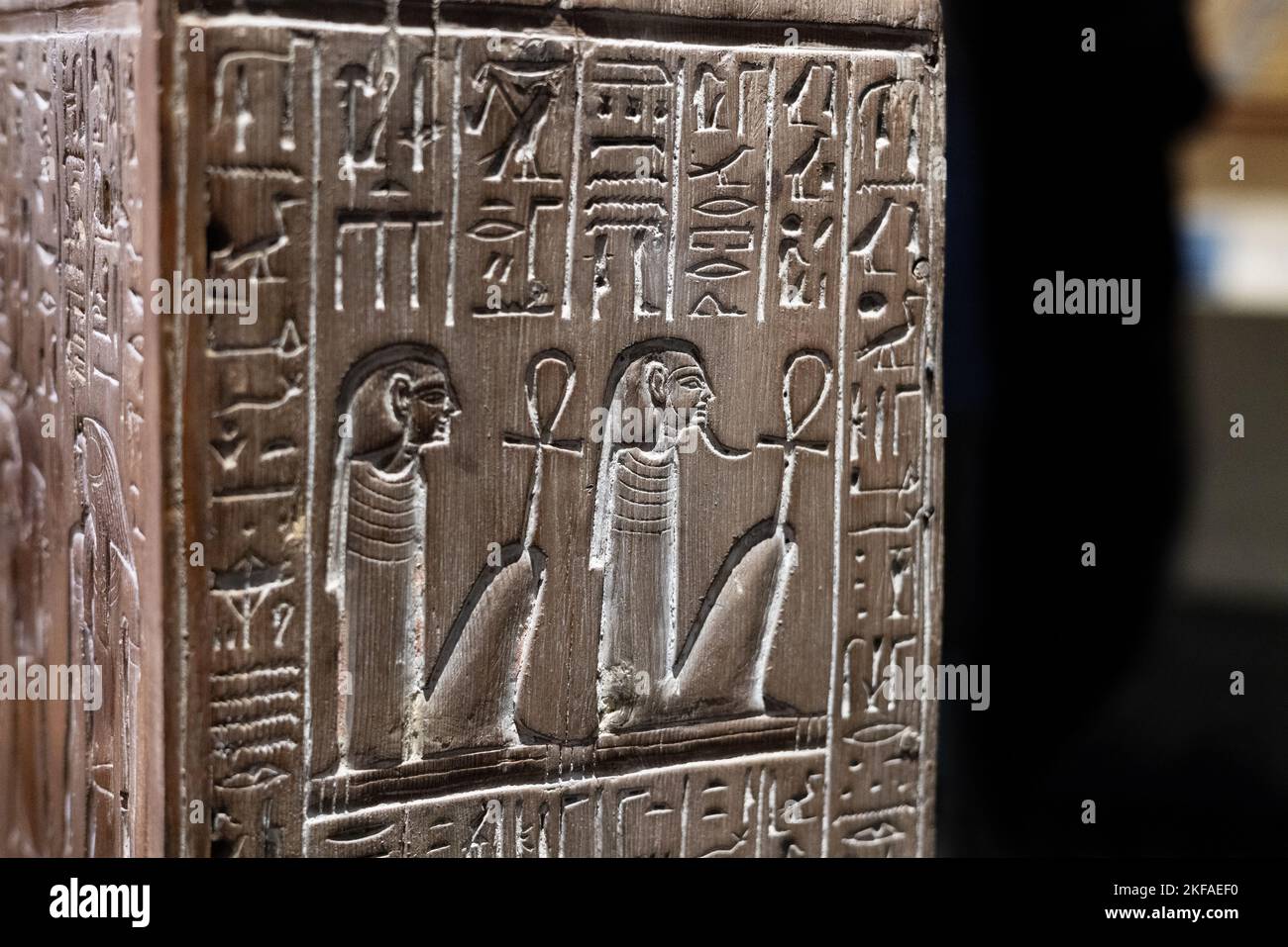 Egyptian hieroglyphjcs; Ancient egyptian wooden box dated 1550-1295 BC, carved with images of servants and the four sons of Horus, Ancient Egypt. Stock Photo
