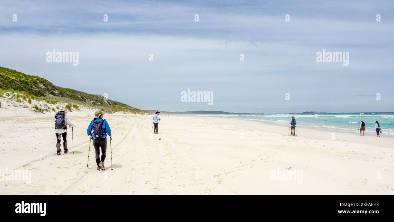 Walkers hiking the Cape to Cape Track  walking on Neretlis Beach Leeuwin-Naturaliste National Park Western Australia. Stock Photo