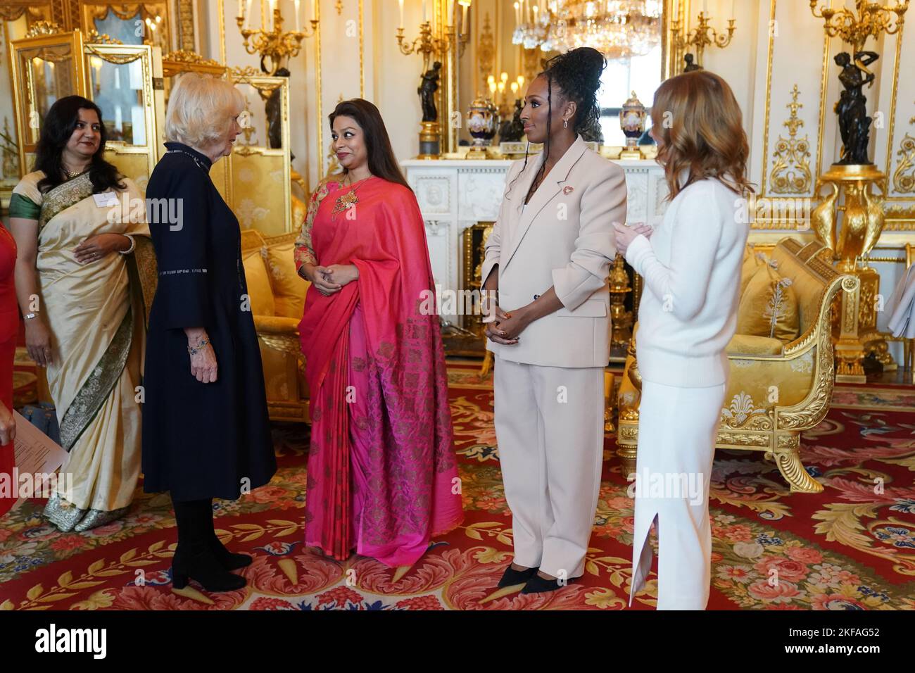 The Queen Consort with (left to right) Ayesha Dharker, Alexandra Burke and Geri Horner during a reception for winners of the Queen's Commonwealth Essay Competition, at Buckingham Palace in London. Picture date: Thursday November 17, 2022. Stock Photo